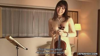 Horny Yuria Tominaga plays a violin and rubs her pussy
